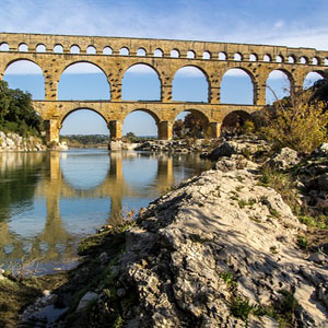 a roman aqueduct supplying water to a nearby city