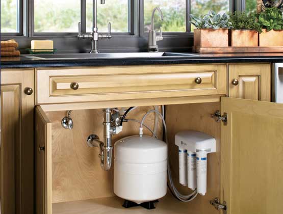A reverse osmosis system installed under the sink at home