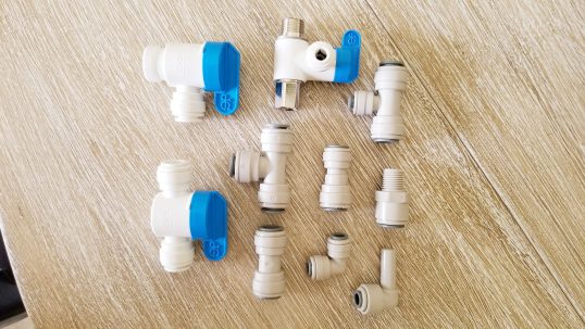 A variety of John Guest quick connect fittings available at the water store