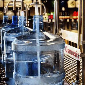 pure-water-goleta filling up a 5 gallon bottle of distilled water